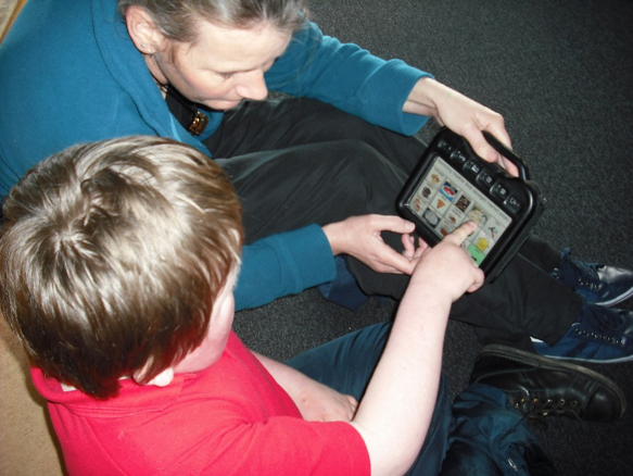 kid playing on tablet